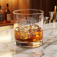 Load image into Gallery viewer, Glass of whiskey with a logo on a marble surface
