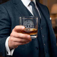 Load image into Gallery viewer, Man in a suit holding a glass of whiskey with an engraved logo. The Citadel, Ring Bezel, Class of 1968, Whiskey Glass, 10.5oz (Engraving)

